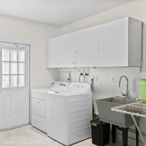 Convenient laundry room with washer and dryer for easy, stress-free stays.