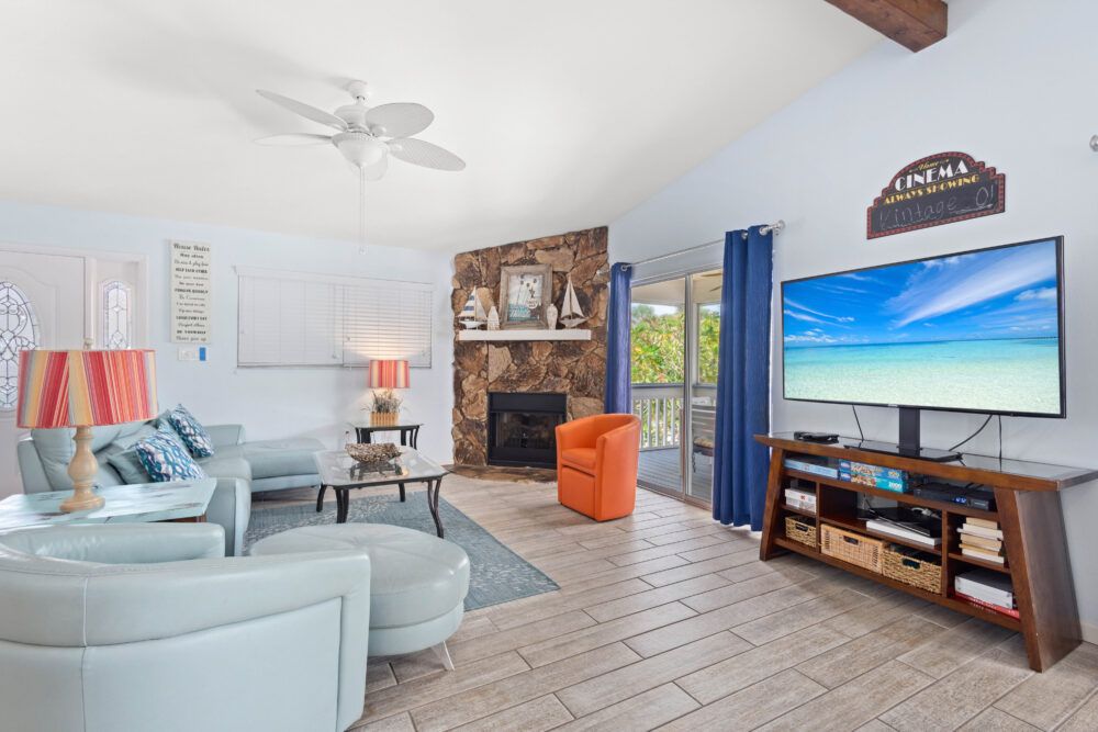 Relax in the den on the leather couch. Enjoy the tv and gas fireplace.