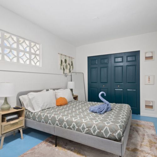 Bright and inviting bedroom designed for restful nights and relaxing vacation mornings.