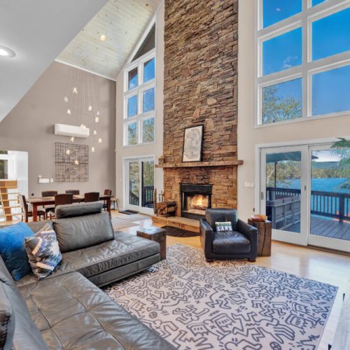 Living Room on the main level. Soaring ceilings, floor to ceiling glass.