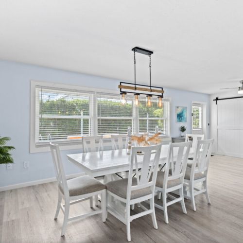 Elegant dining room table offering plenty of space for family meals, gatherings with friends, or a leisurely breakfast before a day at the beach.