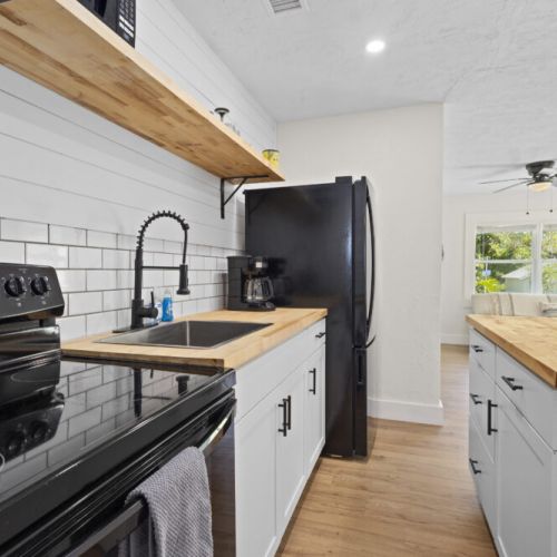 Oven, Microwave, Refrigerator, Coffee Maker.