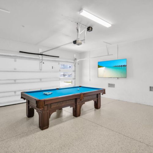 Watch the game or play some music on the 75" TV in the game room.