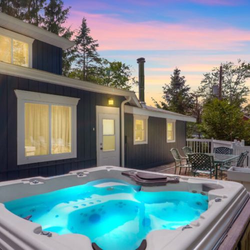 Soak in the hot tub while enjoying a very pleasant view.
