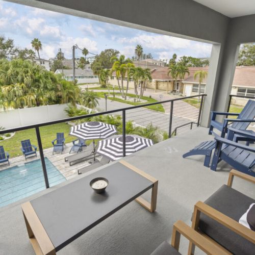 Balcony views overlooking the pool and backyard oasis.