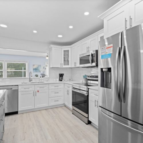 Modern kitchen featuring stainless steel appliances for a stylish and functional cooking experience.