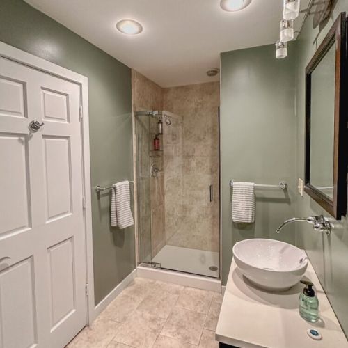 Full bathroom on the main level's walk in shower.