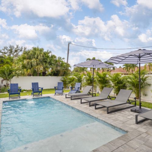 Relax and soak up the sun by the sparkling pool with plenty of lounge chairs.