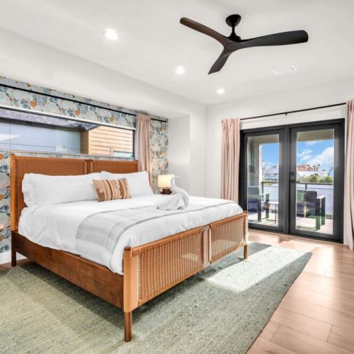 A thoughtfully designed primary retreat — featuring a king Helix mattress for restful nights, blackout curtains for total relaxation, and a fun, energetic reef wallpaper that brings a smile to your face every time you wake up.