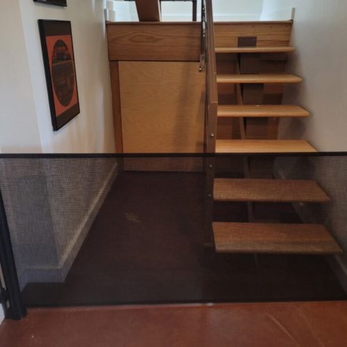 Mesh baby gate added at the bottom of the stairs.