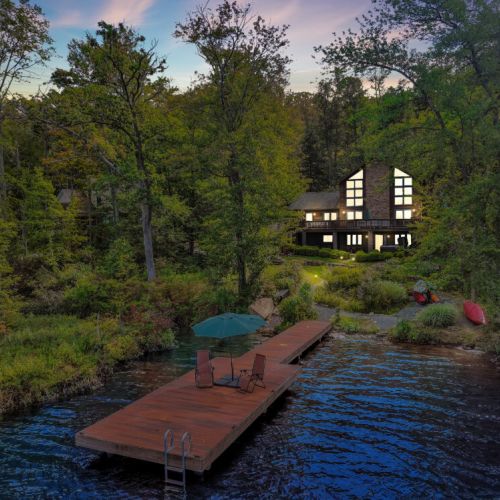 The house lit up at sunset.