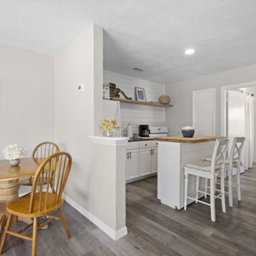 Dining table and kitchen.
