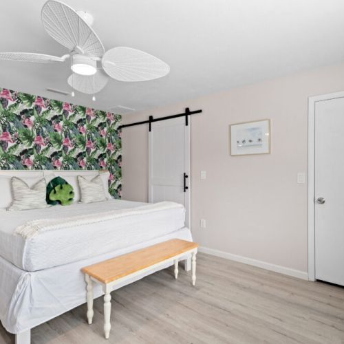 Relax and recharge in the airy main bedroom, designed for ultimate comfort and a peaceful night’s sleep after a day at the beach.