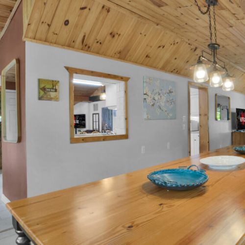 Gather around the spacious dining table, perfect for family meals, game nights, or planning your next adventure together
